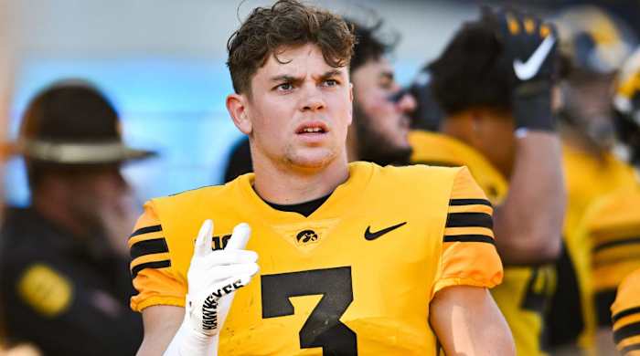 Iowa's Cooper DeJean reacts on the sideline.